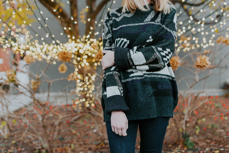 woman wearing Christmas sweater